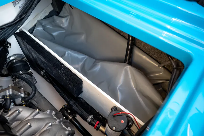 Slide: The Image of 2023 Yamaha Boats 222XD engine compartment with visible components and wiring. - 12