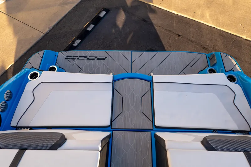 Slide: The Image of 2023 Yamaha Boats 222XD swim platform with cushioned seating and sleek design. - 19
