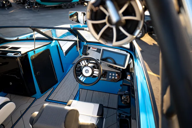 Slide: The Image of 2023 Yamaha Boats 222XD cockpit with steering wheel, touchscreen, and modern controls. - 20
