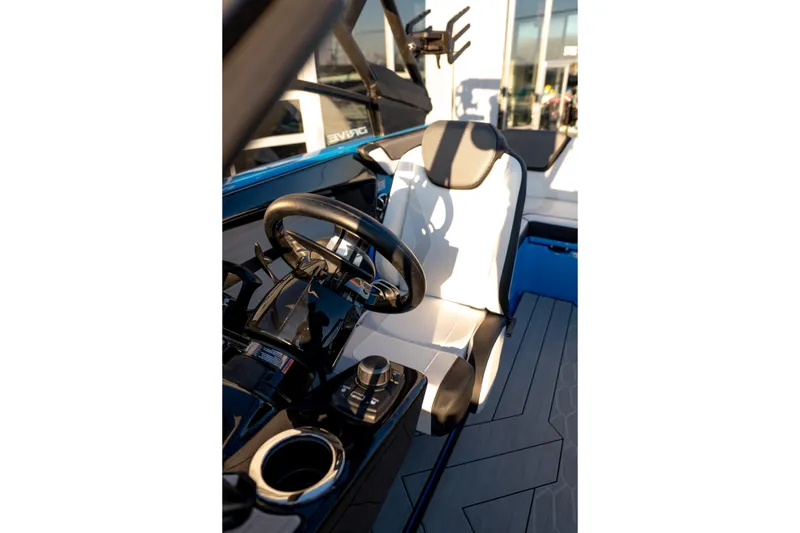 Slide: The Image of 2023 Yamaha Boats 222XD cockpit with steering wheel and modern controls. - 25