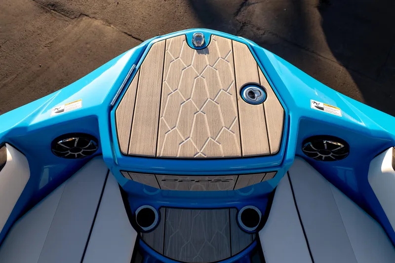 Slide: The Image of 2023 Yamaha Boats 222XD, blue deck with stylish wood finish and speakers. - 28