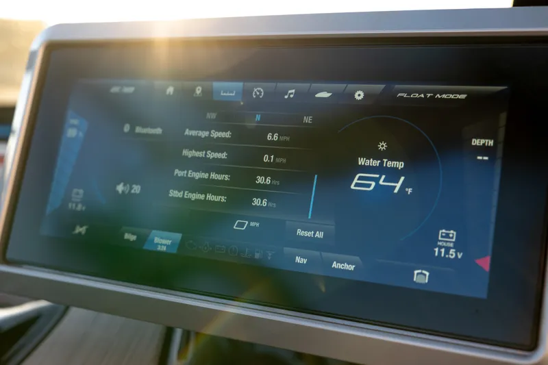 Slide: The Image of Dashboard display of 2023 Yamaha Boats 222XD showing speed, engine hours, and water temperature. - 9