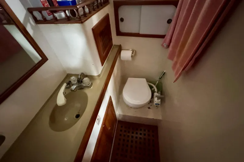 Slide: The Image of Compact bathroom in 1982 Tung Hwa Seahorse boat with sink, toilet, and storage. - 10