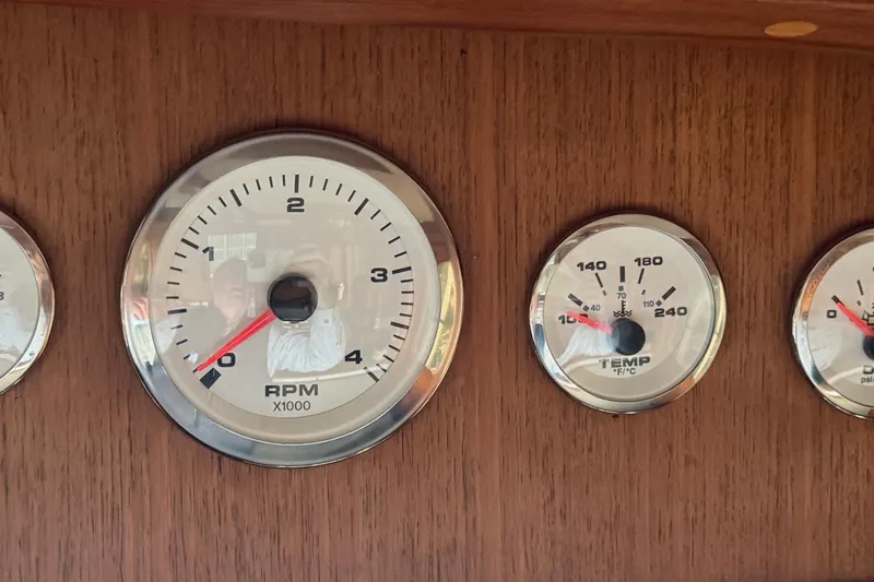 Slide: The Image of Close-up of 1982 Tung Hwa Seahorse boat gauges, showing RPM and temperature dials. - 15