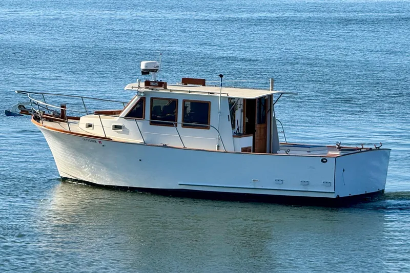 Slide: The Image of 1982 Tung Hwa Seahorse boat on calm blue water, side view. - 2