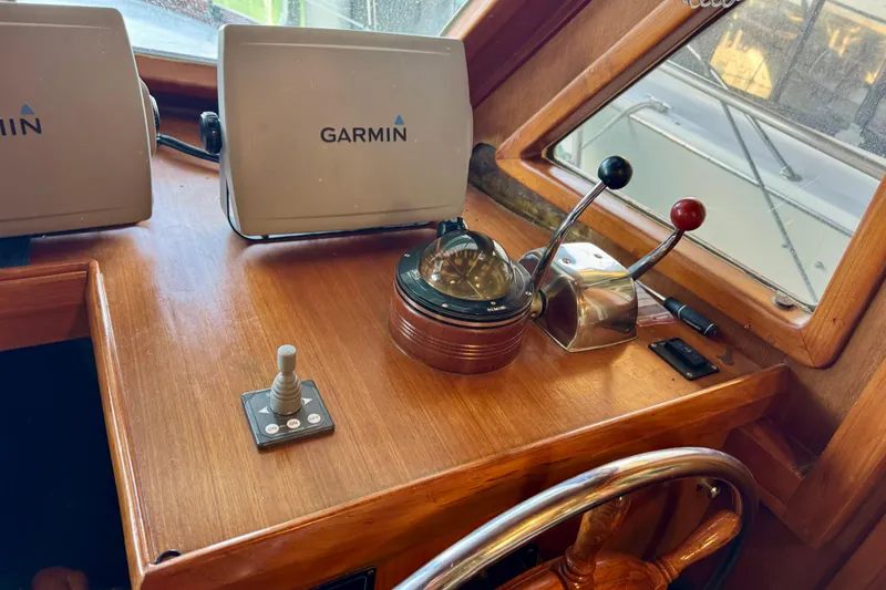 Slide: The Image of 1982 Tung Hwa Seahorse helm with Garmin navigation, compass, and throttle controls. - 22