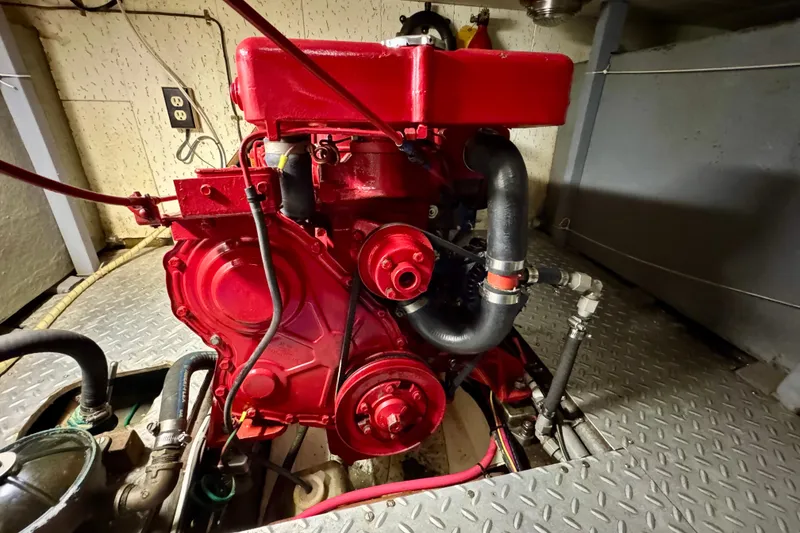 Slide: The Image of Red engine of a 1982 Tung Hwa Seahorse boat in a mechanical room. - 28