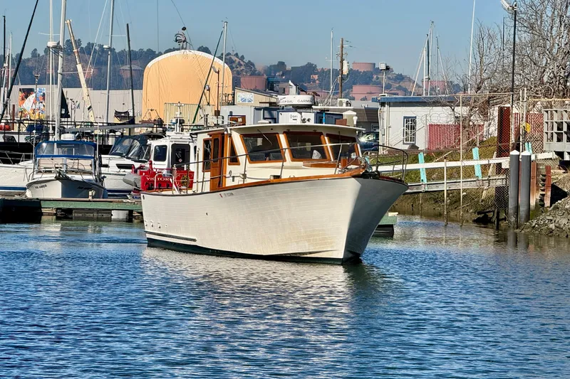 Slide: The Image of 1982 Tung Hwa Seahorse boat docked in a marina, surrounded by other vessels. - 4