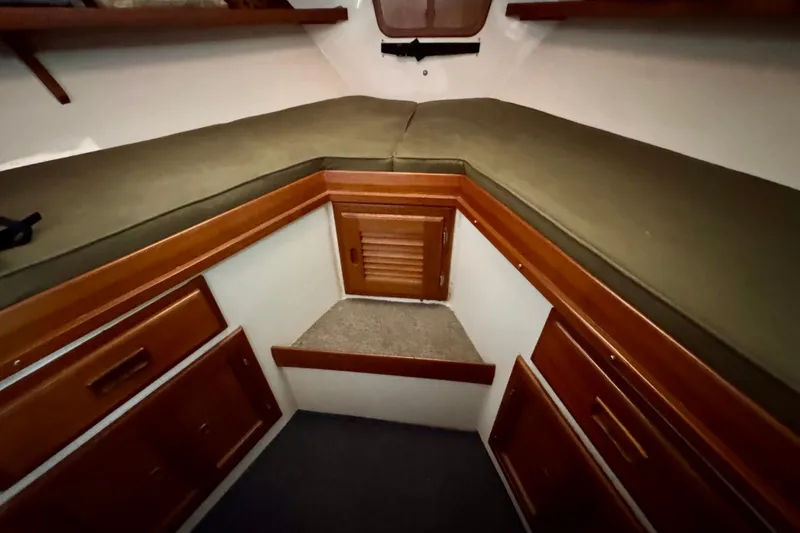 Slide: The Image of 1982 Tung Hwa Seahorse cabin interior with wooden storage and cushioned seating. - 6
