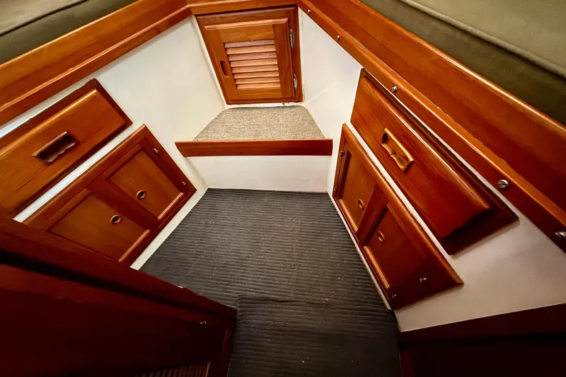 Slide: The Image of 1982 Tung Hwa Seahorse interior with wooden cabinets and carpeted floor. - 7