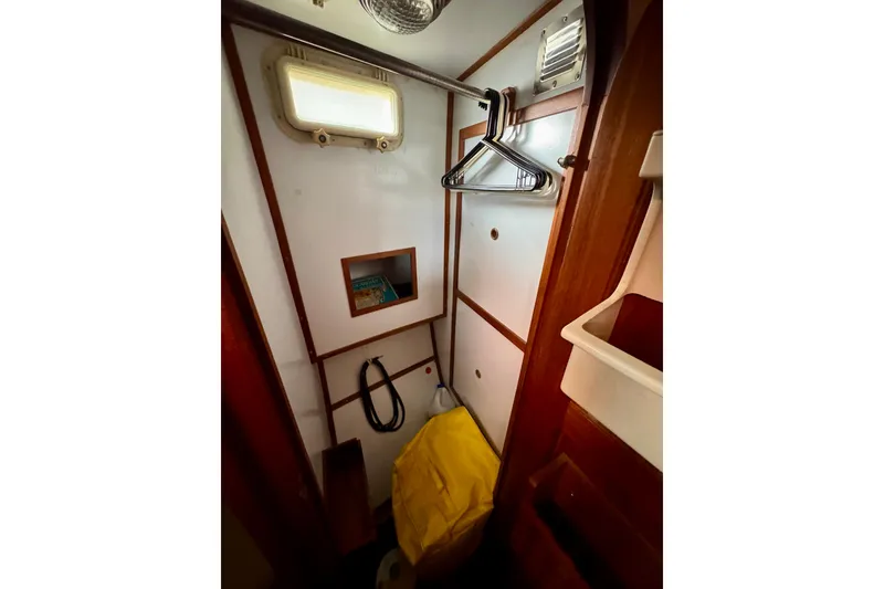 Slide: The Image of 1982 Tung Hwa Seahorse interior closet with hangers, window, and storage space. - 8