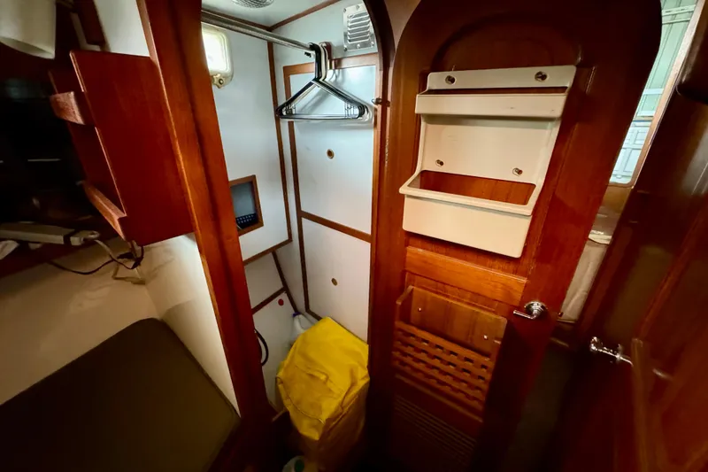 Slide: The Image of 1982 Tung Hwa Seahorse yacht interior with wooden cabinetry and storage space. - 9