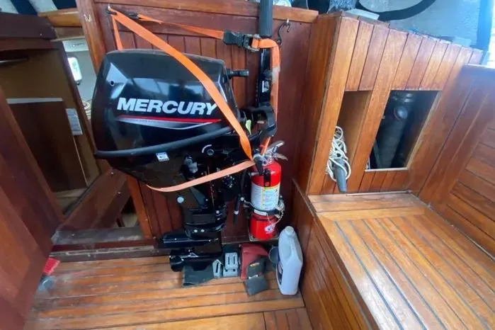 Slide: The Image of 1966 Vanguard Bermudian Sloop interior with Mercury engine and wooden seating. - 19