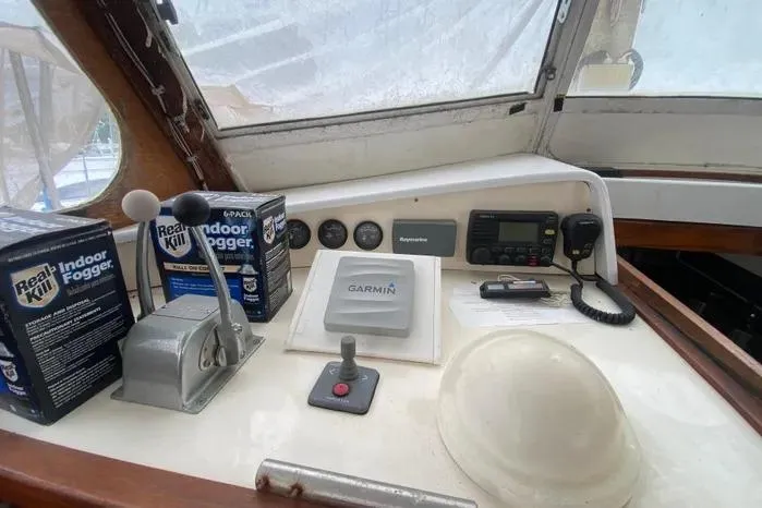 Slide: The Image of Cockpit of 1966 Vanguard Bermudian Sloop with navigation equipment and indoor fogger products. - 20