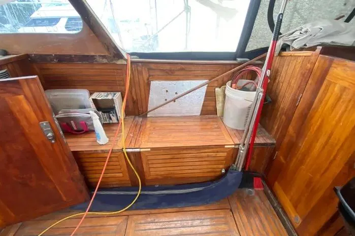 Slide: The Image of Interior of 1966 Vanguard Bermudian Sloop with wooden paneling and nautical equipment. - 23