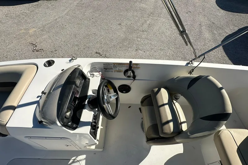Slide: The Image of 2019 Hurricane SunDeck Sport 188 OB boat interior with steering wheel and seating. - 13
