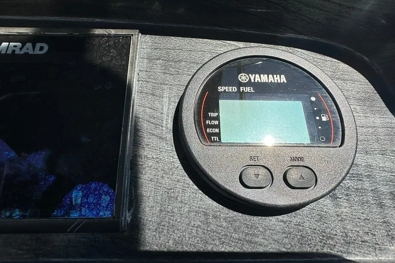 Slide: The Image of Dashboard of a 2019 Hurricane SunDeck Sport 188 OB with Yamaha speed and fuel gauge. - 15