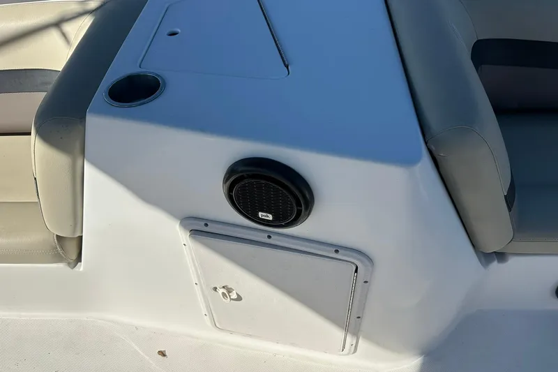 Slide: The Image of 2019 Hurricane SunDeck Sport 188 OB boat interior with speaker and seating. - 19