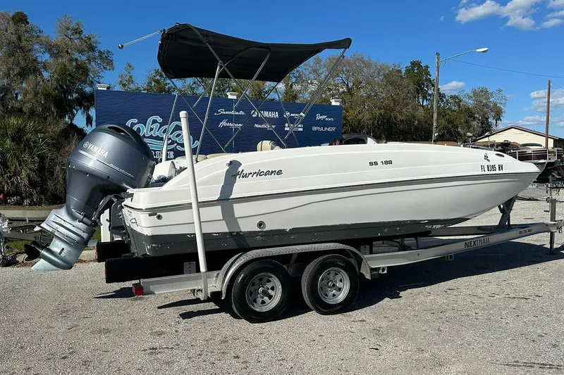 Slide: The Image of 2019 Hurricane SunDeck Sport 188 OB boat on trailer with Yamaha outboard motor. - 2