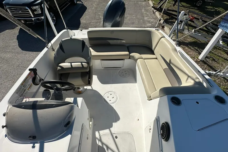 Slide: The Image of 2019 Hurricane SunDeck Sport 188 OB boat interior with seating and steering console. - 20