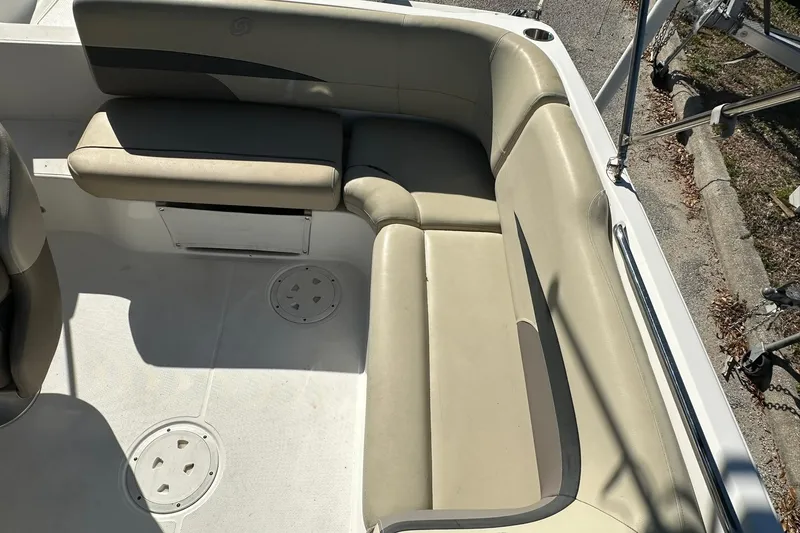 Slide: The Image of 2019 Hurricane SunDeck Sport 188 OB boat interior with beige seating and stainless steel railings. - 21