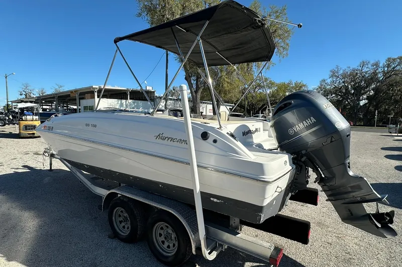 Slide: The Image of 2019 Hurricane SunDeck Sport 188 OB boat with Yamaha outboard motor on trailer. - 4