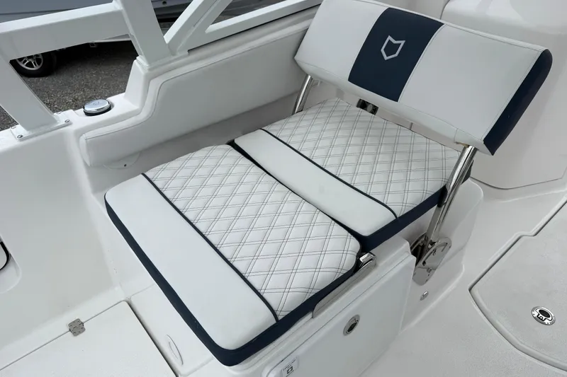 Slide: The Image of 2026 Sea Fox 268 Traveler boat seat with diamond-pattern upholstery and sleek design. - 11