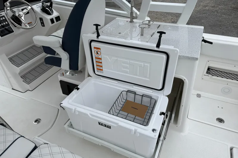 Slide: The Image of 2026 Sea Fox 268 Traveler boat interior with Yeti cooler and captain's chair. - 12