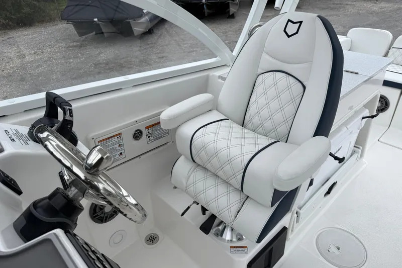 Slide: The Image of Captain's chair and helm of 2026 Sea Fox 268 Traveler boat, featuring sleek design. - 15