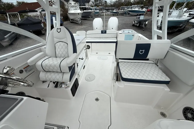 Slide: The Image of 2026 Sea Fox 268 Traveler boat interior with cushioned seating and steering wheel. - 16