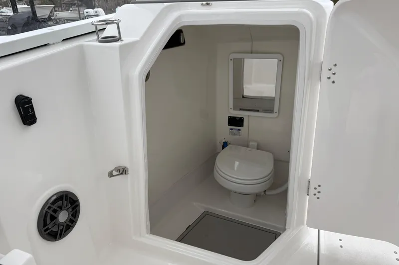 Slide: The Image of 2026 Sea Fox 268 Traveler boat interior with compact marine toilet and mirror. - 18