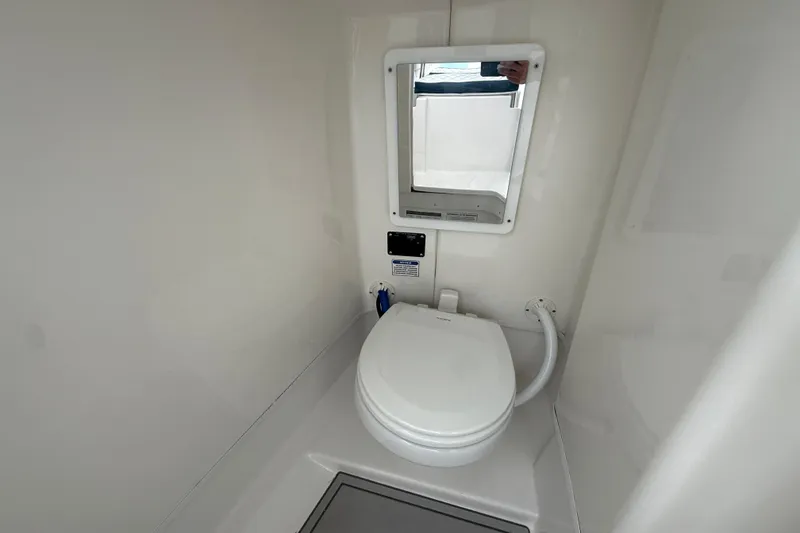 Slide: The Image of 2026 Sea Fox 268 Traveler boat bathroom with toilet and mirror. - 19