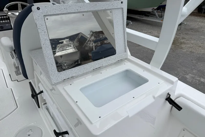 Slide: The Image of 2026 Sea Fox 268 Traveler boat interior with storage compartment and reflective panel. - 20