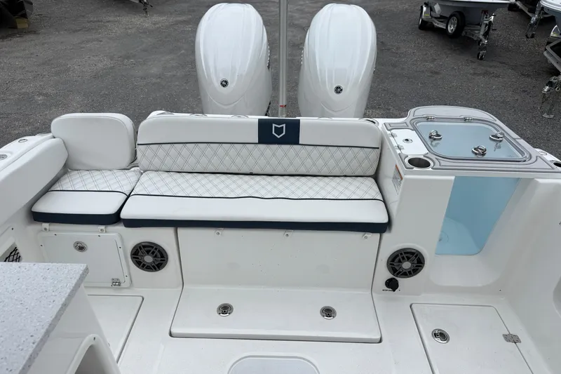 Slide: The Image of 2026 Sea Fox 268 Traveler boat interior with cushioned seating and dual engines. - 22
