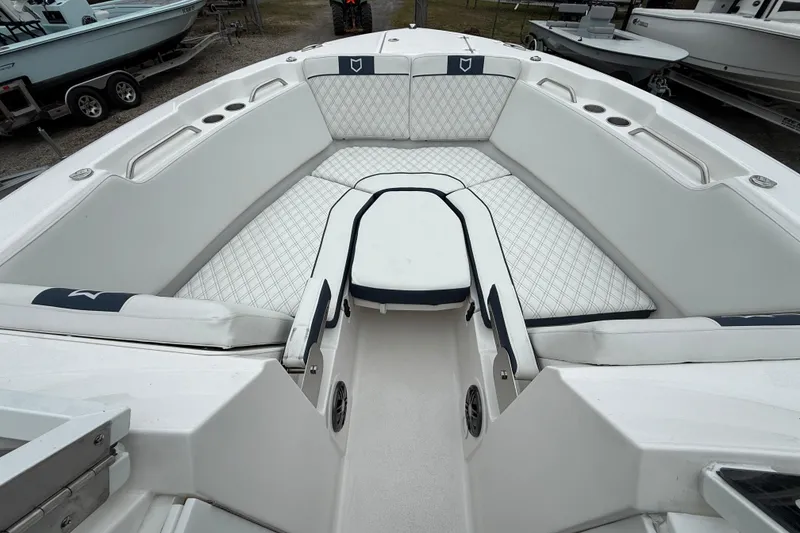 Slide: The Image of 2026 Sea Fox 268 Traveler boat interior with white cushioned seating and storage compartments. - 24