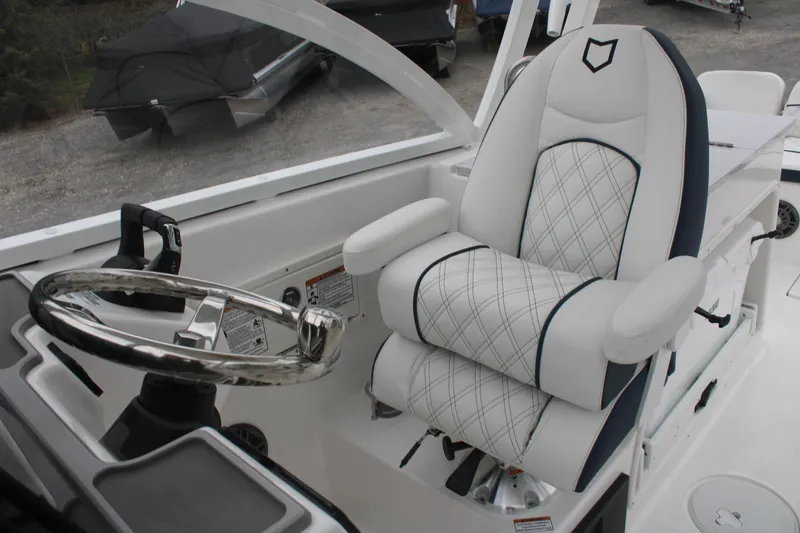 Slide: The Image of Captain's seat and steering wheel of 2026 Sea Fox 268 Traveler boat, featuring luxurious design. - 9