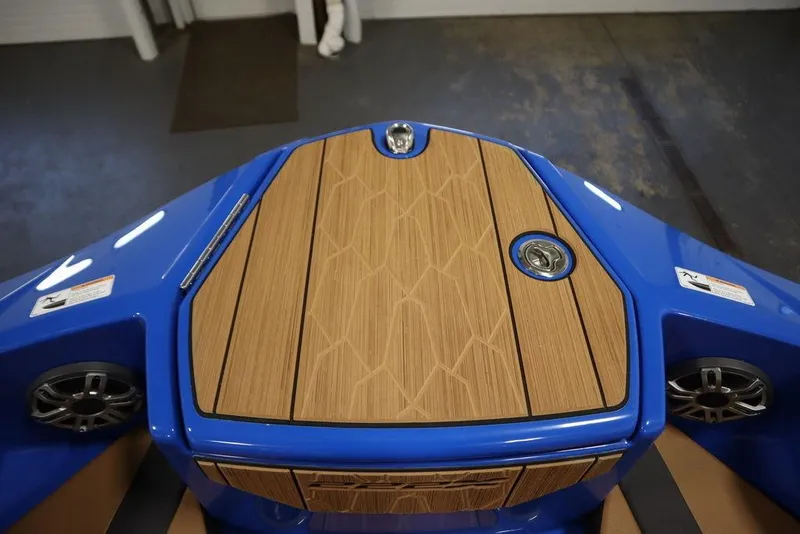 Slide: The Image of 2024 Yamaha Boats 222XE bow with teak-style decking and blue finish. - 13