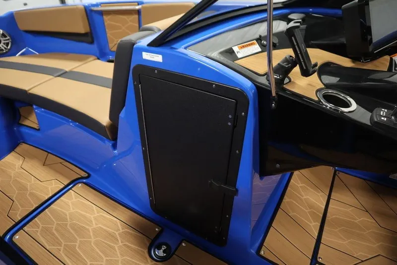 Slide: The Image of 2024 Yamaha Boats 222XE interior with blue accents and tan seating. - 18