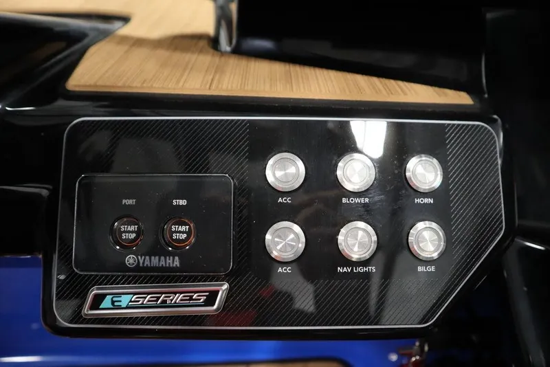 Slide: The Image of Control panel of 2024 Yamaha Boats 222XE with start buttons and accessory switches. - 28