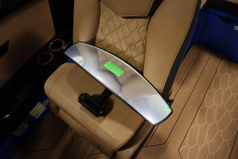Slide: The Image of 2024 Yamaha Boats 222XE interior with tan seat and mirror on floor. - 31