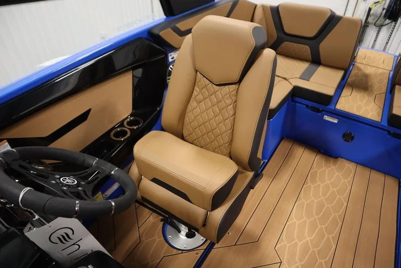 Slide: The Image of 2024 Yamaha Boats 222XE interior with tan seating and blue accents. - 34