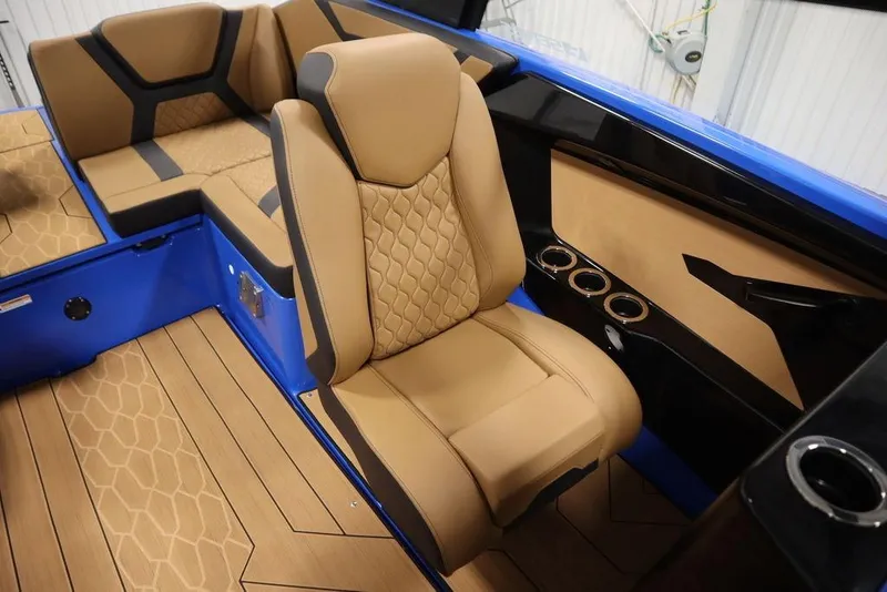 Slide: The Image of 2024 Yamaha Boats 222XE interior with tan seating and blue accents. - 42