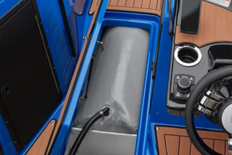 Slide: The Image of 2024 Yamaha Boats 222XE interior with storage compartment and control panel. - 59
