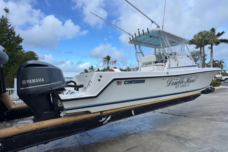 Slide: The Image of 2002 Contender 31 Fisharound boat with Yamaha engine, docked in Key Largo, Florida. - 3