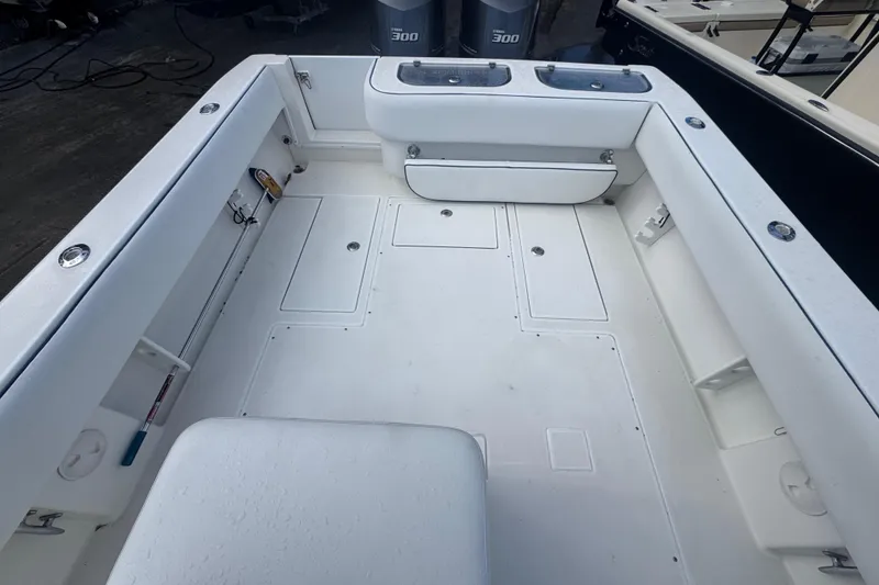 Slide: The Image of 2002 Contender 31 Fisharound boat interior with spacious deck and storage compartments. - 5