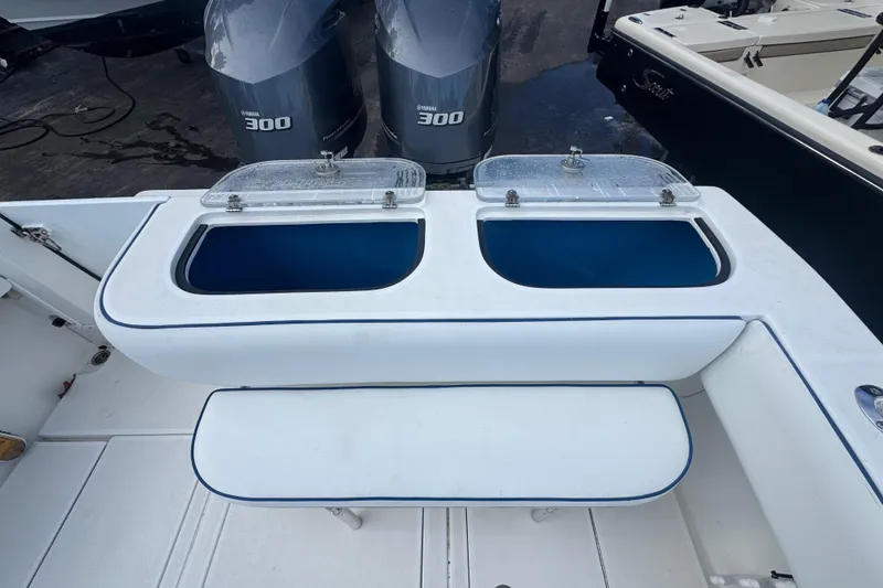 Slide: The Image of 2002 Contender 31 Fisharound boat with dual Yamaha 300 engines and livewell compartments. - 7