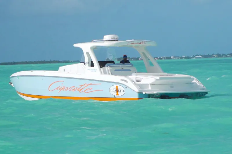 The Image of 2019 Cigarette 41' Nighthawk SD Edition boat on turquoise water. - 0