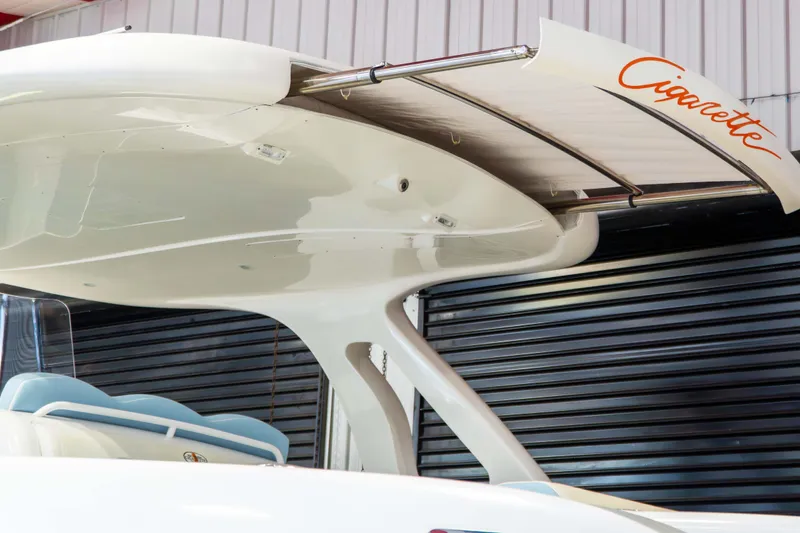 Slide: The Image of 2019 Cigarette 41' Nighthawk SD Edition boat with sleek design and branding. - 4