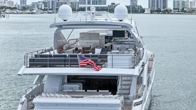 Slide: The Image of Luxury Azimut 95 Raised Pilothouse yacht, 2017 model, cruising near city skyline. - 18
