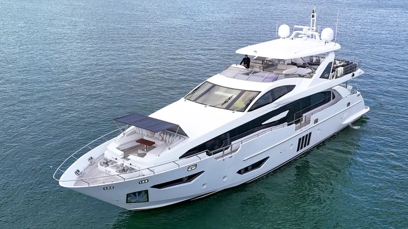 Slide: The Image of Luxury 2017 Azimut 95 Raised Pilothouse yacht cruising on open water. - 20